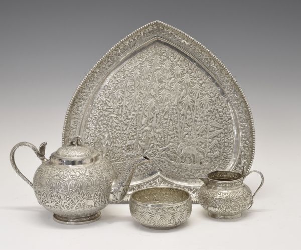 Indian white metal four piece tea service comprising: globular teapot, the hinged cover with