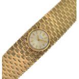 Universal Genève - 9ct gold lady's bracelet watch, the circular signed white dial with gilt hands