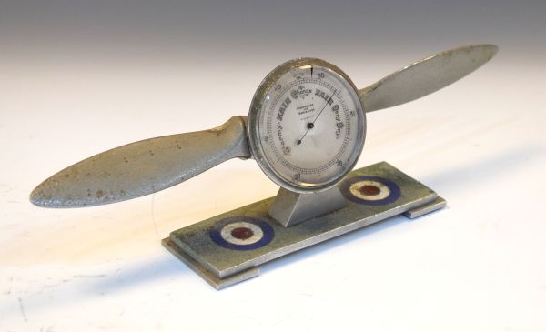 Early 20th Century desk barometer in the form of an aero propeller on a rectangular plinth with