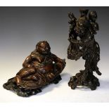 Two carved Oriental figures, the taller standing 36cm high Condition: