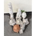 Eight various reconstituted garden ornaments to include; two lion masks, two wolf masks, skull,