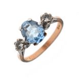 9ct gold dress ring set central pale blue stone flanked by two white stones, size O½, 3.1g gross