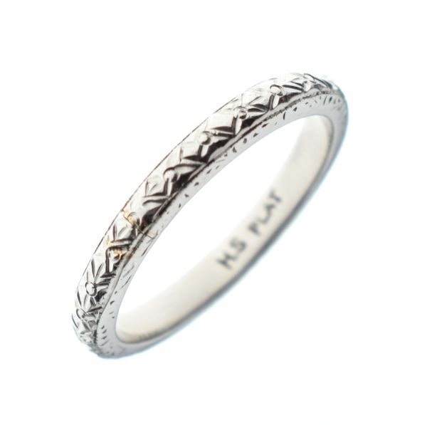 Engraved wedding band, the shank stamped Plat, size L, 4.4g gross approx Condition: