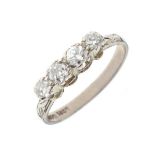 Four stone diamond ring, the white metal shank stamped 18ct, size L, 2.3g gross approx Condition: