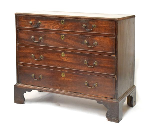 George III mahogany chest of four long drawers, the moulded rectangular top over cockbeaded