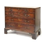 George III mahogany chest of four long drawers, the moulded rectangular top over cockbeaded