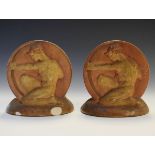 Pair of stoneware bookends, each decorated in relief with a classical male archer Condition: