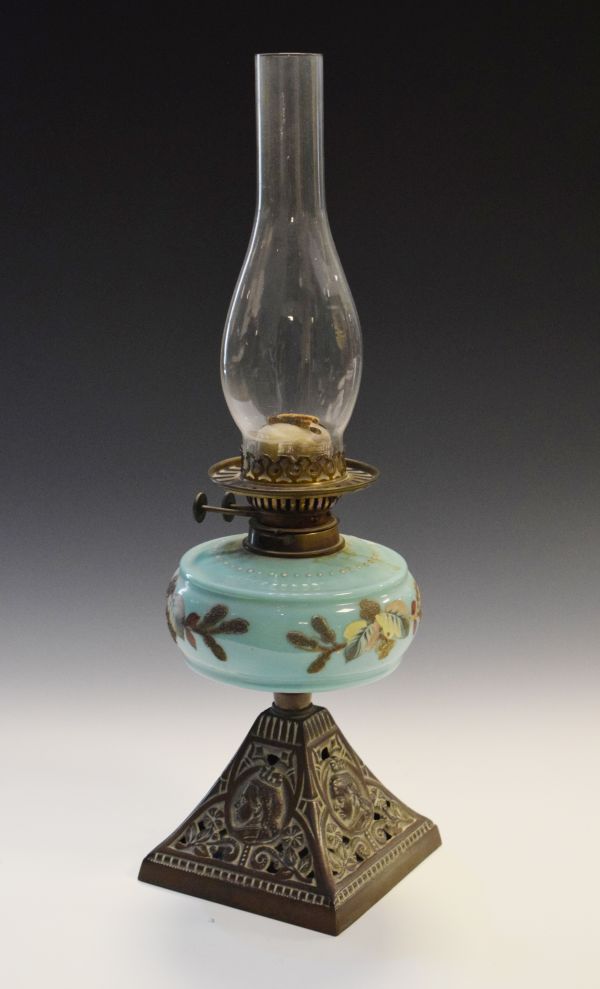 Victorian oil lamp, the pale blue glass reservoir having painted foliate decoration, the pyramid