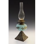 Victorian oil lamp, the pale blue glass reservoir having painted foliate decoration, the pyramid