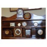 Ten assorted clocks and barometers to include; American mantel clock, German mantel clock by