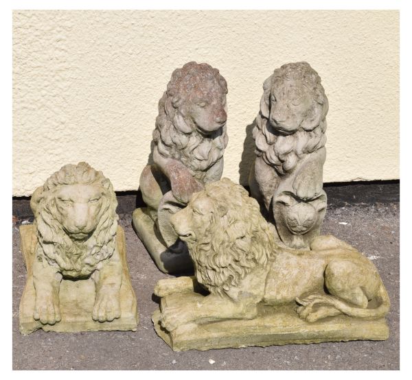 Garden Ornaments - Two pairs of lion figurines comprising: a pair seated holding shields and a