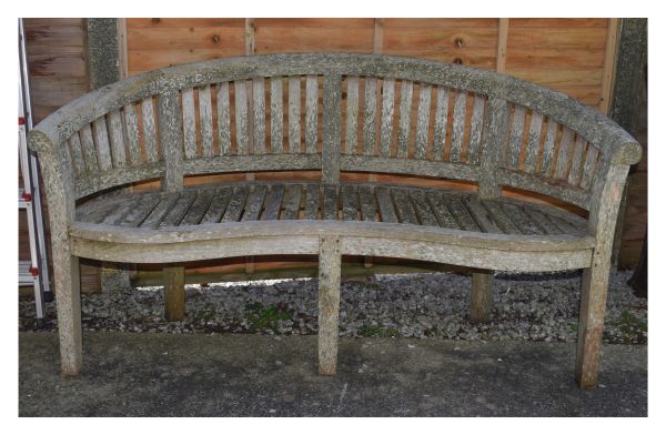 Teak garden bench of curved tub back design with serpentine fronted seat, 160cm wide Condition: