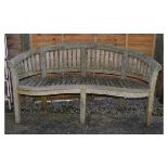 Teak garden bench of curved tub back design with serpentine fronted seat, 160cm wide Condition: