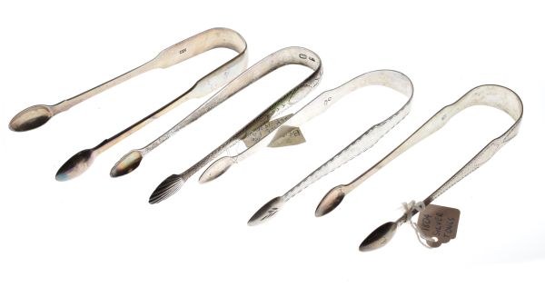 Pair of Georgian Irish silver sugar tongs, two other pairs of Georgian tongs and a pair of William