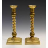 Pair of 20th Century heavy brass candlesticks, each having a barley twist column Condition: