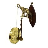 20th Century brass and oak wall-mounted gong, the bracket modelled as an elephant with trunk