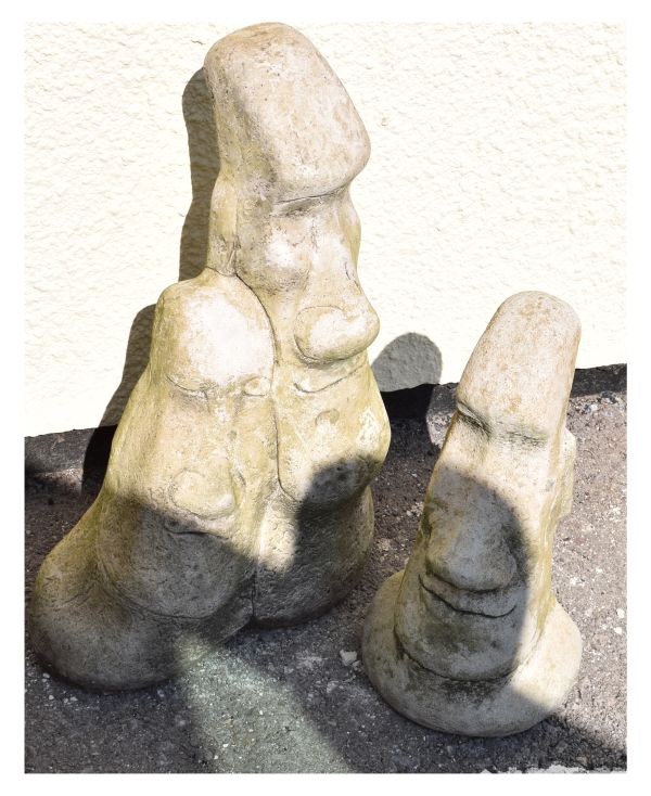 Garden Ornaments - Two figures in the manner of Easter Island 'Moai', the larger 56cm high (2)