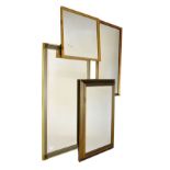 Four assorted wall mirrors, the largest with bevelled plate measuring 49cm x 79cm excluding frame (