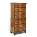 Old reproduction serpentine-fronted walnut chest on chest or tallboy of small proportions, the upper