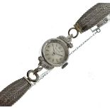 Bulova - Lady's white metal and diamond set cocktail watch, engine turned silver dial with Arabic