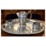 Arts & Crafts-style hammered pewter three piece coffee service by Howard Pewter, together with an