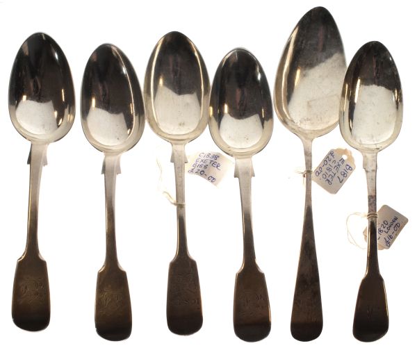 Four various 19th Century Exeter silver Fiddle pattern dessert spoons, a similar London spoon and an