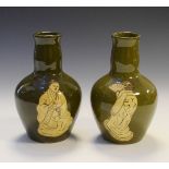 Pair of early 20th Century green glazed baluster shaped vases decorated with Japanese figures