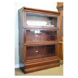 Early 20th Century Globe Wernicke mahogany three tier sectional bookcase having typical up and