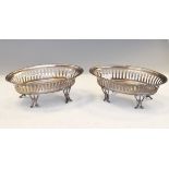 Pair of George V silver oval bon bon dishes, each having typical pierced decoration and standing