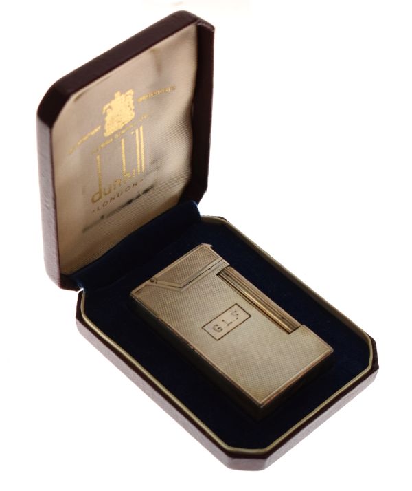 Dunhill sterling silver lighter having engine turned decoration and monogram G.L.S, cased Condition: