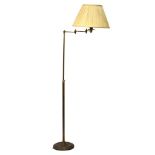 Brass adjustable standard lamp, the shade on a three-part pivoting arm Condition: