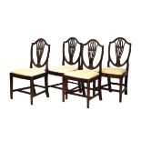 Set of four Hepplewhite style mahogany shield back dining chairs, each having a shaped pierced