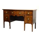 George III inlaid mahogany serpentine-fronted sideboard with boxwood-strung top over conforming