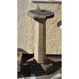 Reconstituted stone garden sundial and pedestal, the circular metal plate on octagonal top, stem and