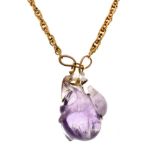 Carved amethyst quartz pendant with unmarked mount and chain Condition: