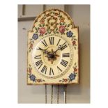 Reproduction cream-finish wall clock in the Black Forest style Condition: