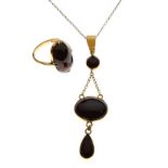 Dress ring stamped '9ct' with oval garnet-coloured stone, size K½, together with a similar pendant