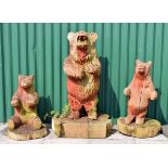 Three large carved wooden bear garden ornaments, the largest 142cm high including base (3)