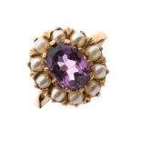 9ct gold ring set central oval amethyst-coloured stone with seed pearl border, size N, 4.4g approx