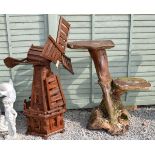 Large stained wooden garden ornament modelled as a windmill, 128cm high, together with a wooden