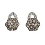 Pair of diamond set flowerhead design earrings, the mounts stamped '14kt 585', 3.5g gross approx