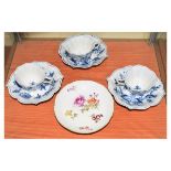 Three Meissen cabinet cups and saucers, each having blue and white painted foliate decoration,