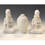 Two Royal Copenhagen white glazed figures - Opium Smoker, together with a similar ovoid vase