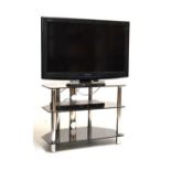 Panasonic Viera 32" colour television with remote and a three-tier stand Condition: