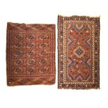 Early 20th Century Turkoman rug typically decorated with rosettes on a red ground within multi