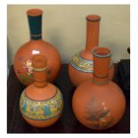 Four late Victorian decorated terracotta vases, largest 25.5cm high (4) Condition: