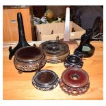 Box containing an assortment of Oriental and other hardwood vase and display stands Condition: