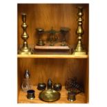 Set of early 20th Century brass postal scales on oak base, together with two brass candlesticks,