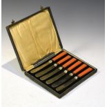 Set of six early 20th Century silver plated tea knives, each having a coral Bakelite handle, cased