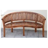 Modern curved slatted garden bench